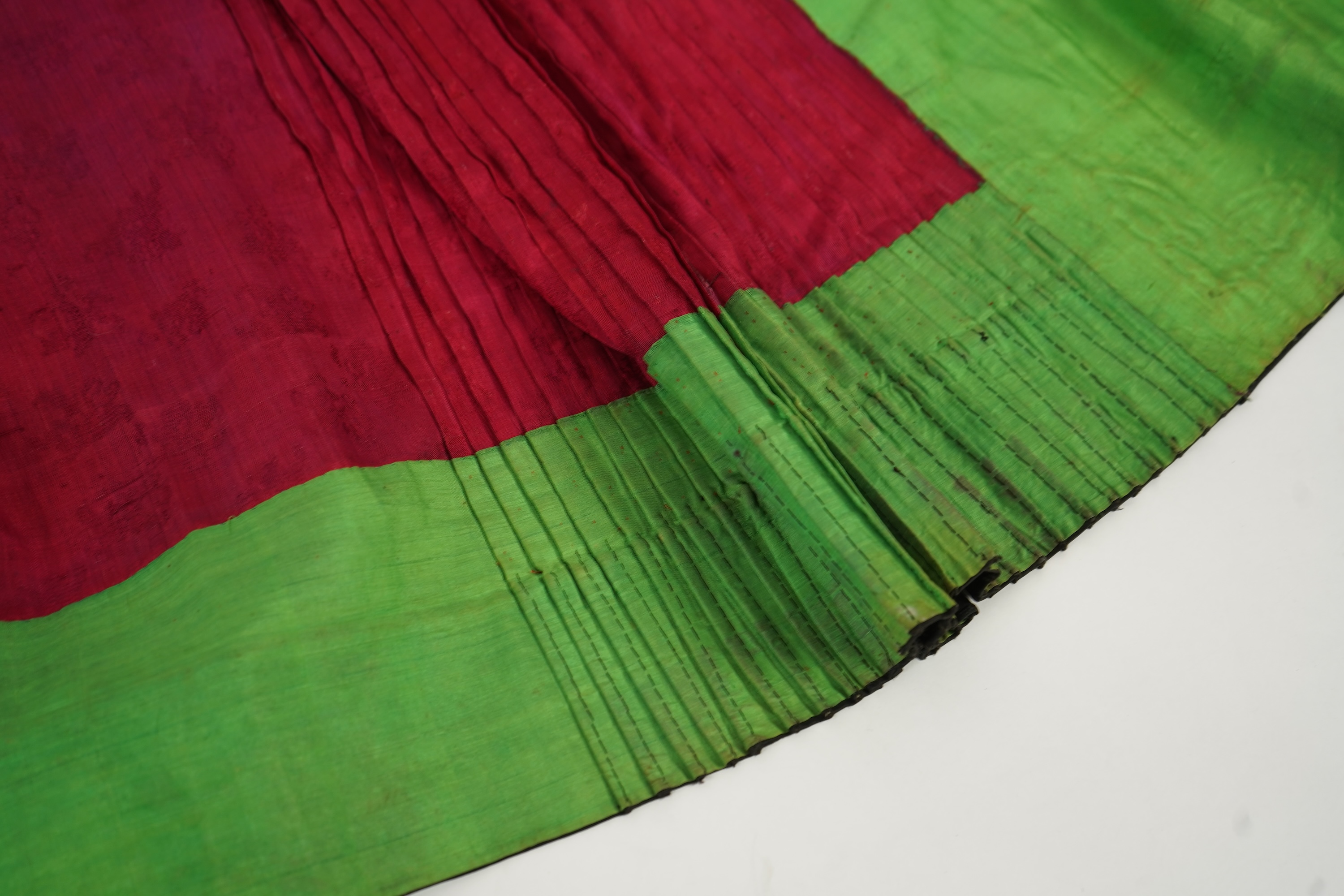 Two Chinese embroidered silk wedding skirts, late Qing, five hats, trousers, two skirt panels and two others, collar and a panel